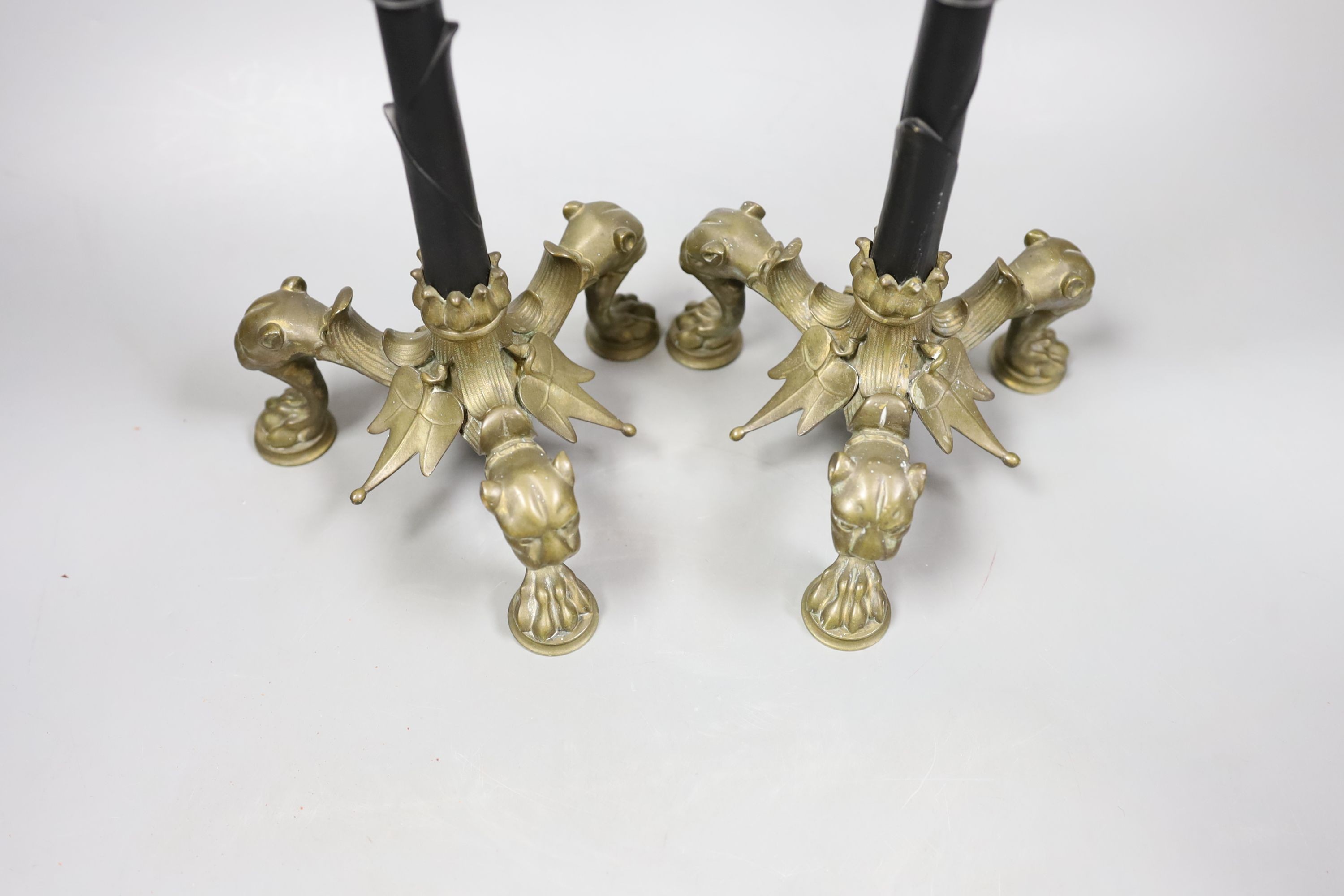 A pair of French ormolu puma footed candlesticks 33cm